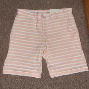 Never worn. White and pink striped khaki shorts. Size 4. GAP.